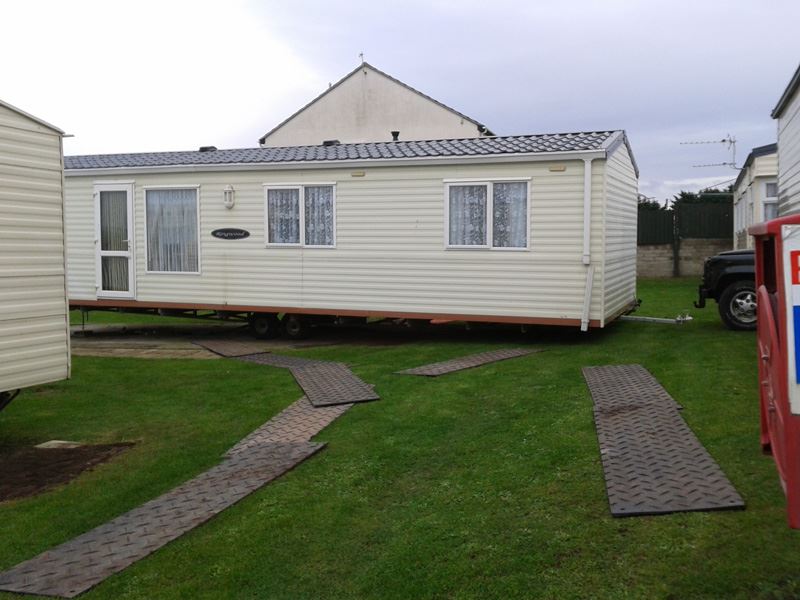 The old caravan is moved back safely ready for removal